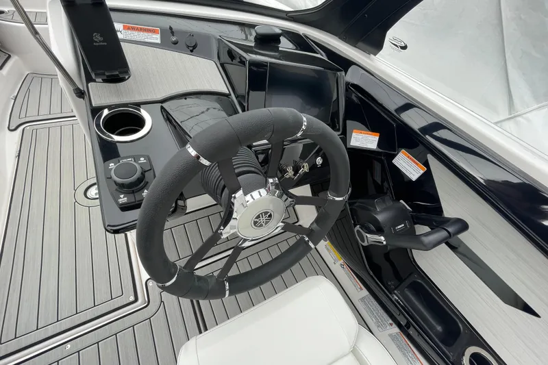 Slide: The Image of 2026 Yamaha Boats 222S steering console with modern controls and sleek design. - 14