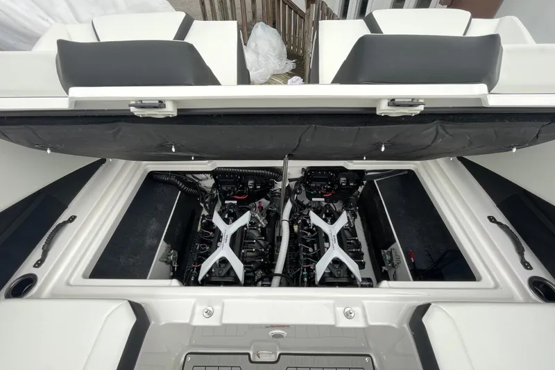 Slide: The Image of 2026 Yamaha Boats 222S engine compartment with dual engines and open hatch. - 16