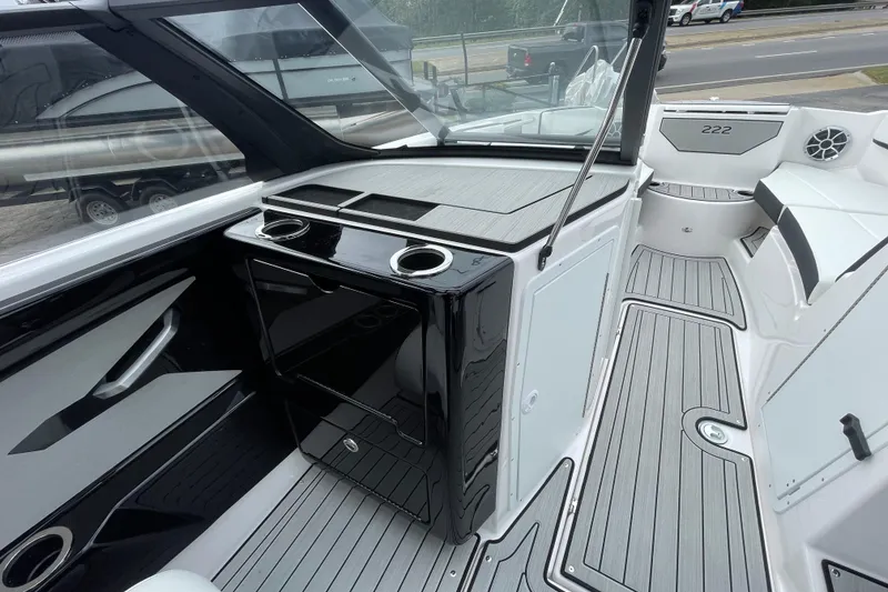 Slide: The Image of 2026 Yamaha Boats 222S interior with sleek design, modern console, and spacious seating. - 17