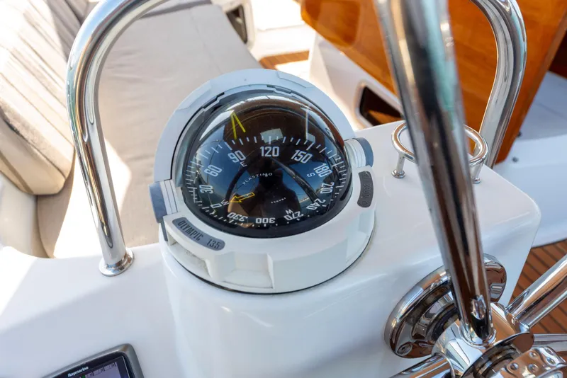 Slide: The Image of Compass on Jeanneau 53 yacht, 2015 model, with polished metal railings. - 15