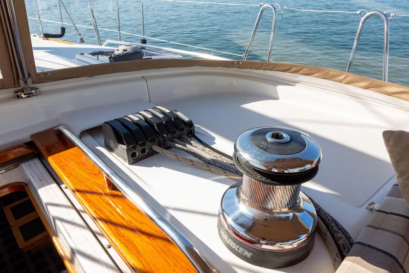 Slide: The Image of Deck of 2015 Jeanneau 53 sailboat with winch and ropes in sunlight. - 19