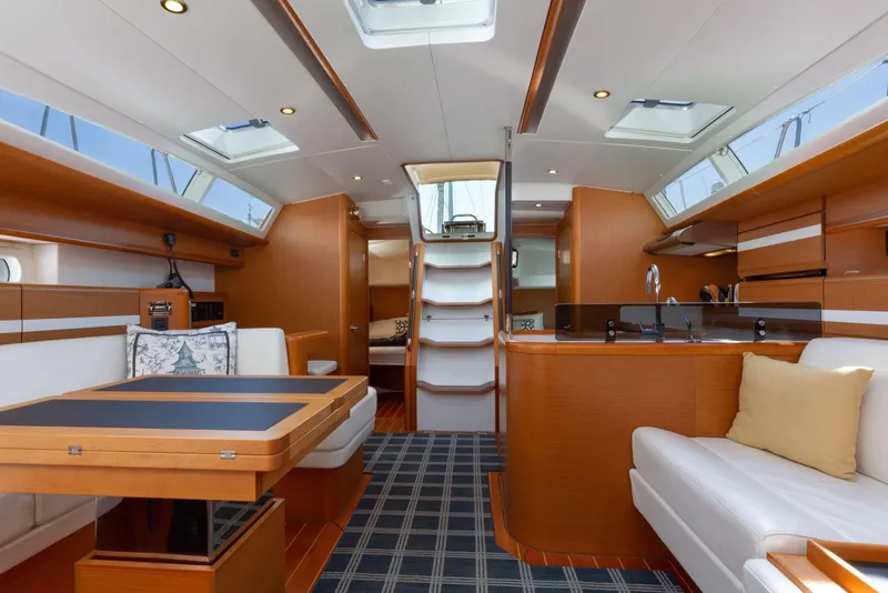 Slide: The Image of Luxurious interior of 2015 Jeanneau 53 yacht with modern furnishings and ample natural light. - 23