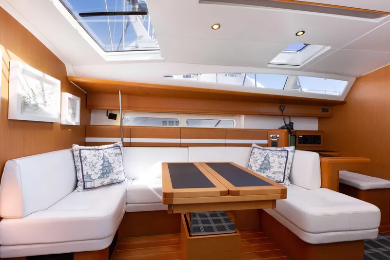 Slide: The Image of Luxurious interior of a 2015 Jeanneau 53 yacht, featuring modern design and elegant wood finishes. - 24