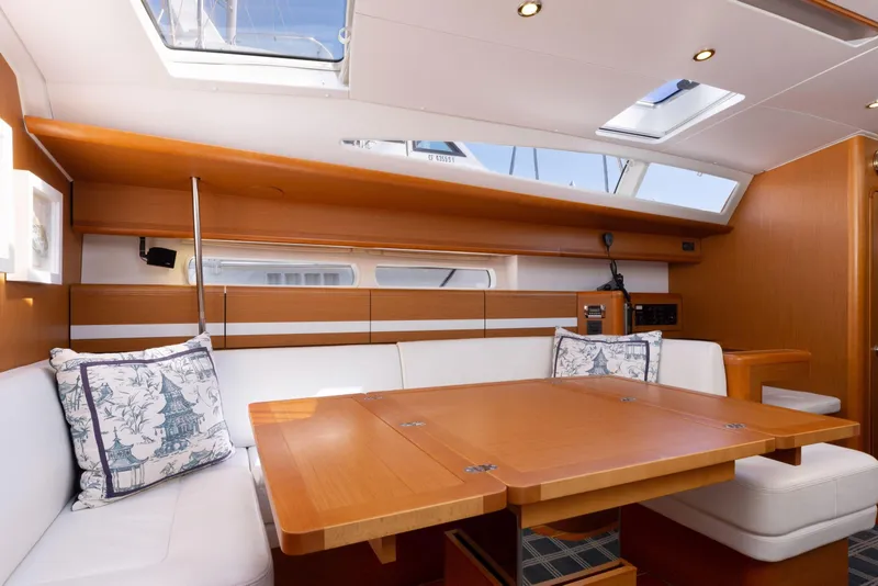 Slide: The Image of Luxurious interior of a 2015 Jeanneau 53 yacht with elegant seating and skylights. - 25