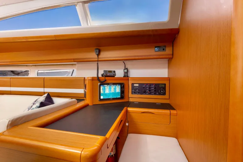 Slide: The Image of Interior of 2015 Jeanneau 53 yacht with elegant wood finish and skylights. - 26