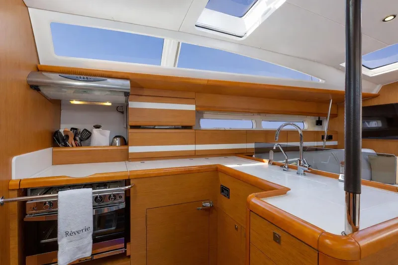 Slide: The Image of Navigation and communication equipment on a 2015 Jeanneau 53 yacht control panel. - 28