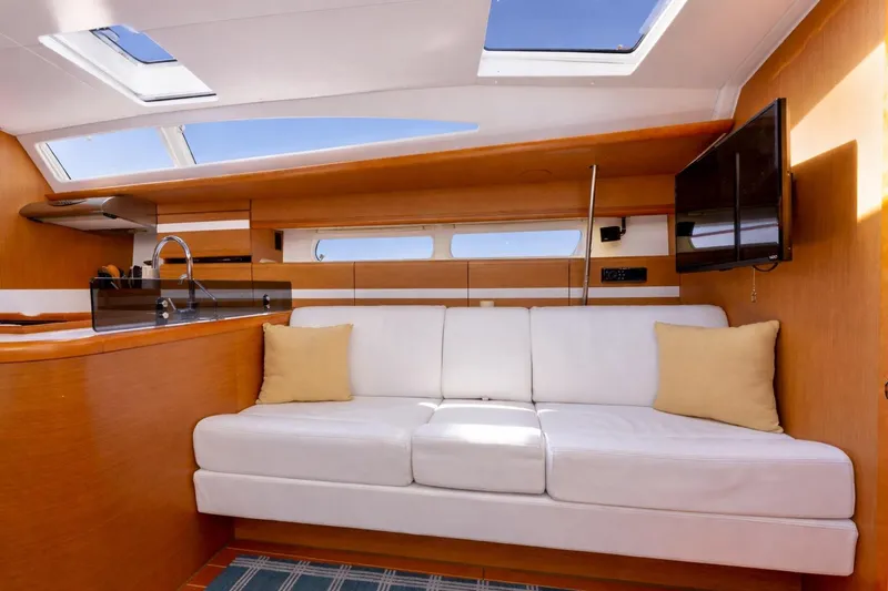 Slide: The Image of Luxurious interior of 2015 Jeanneau 53 yacht featuring modern kitchen and cozy seating area. - 30