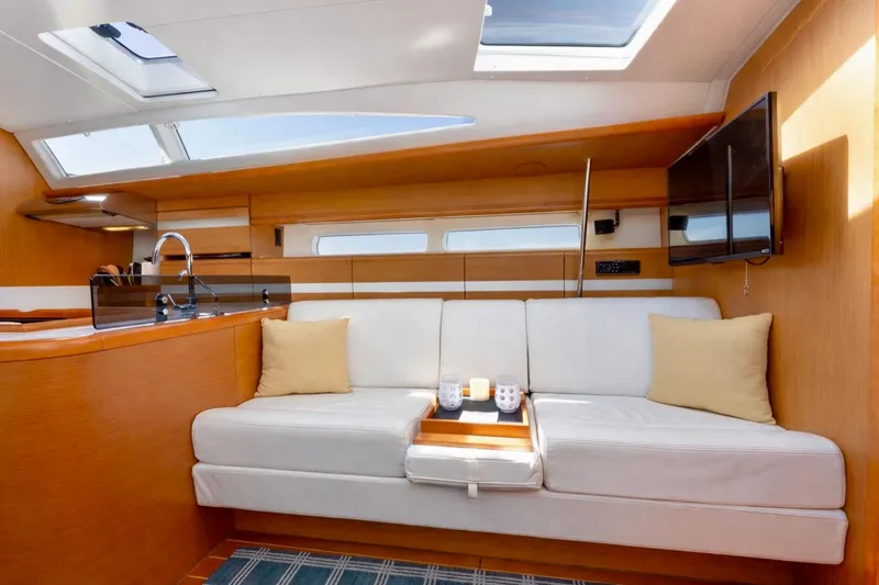 Slide: The Image of Luxurious interior of 2015 Jeanneau 53 yacht with white sofa and modern amenities. - 31