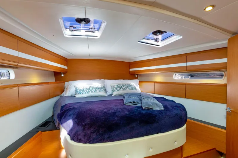 Slide: The Image of Interior of 2015 Jeanneau 53 yacht with modern entertainment system and sleek wood finish. - 34