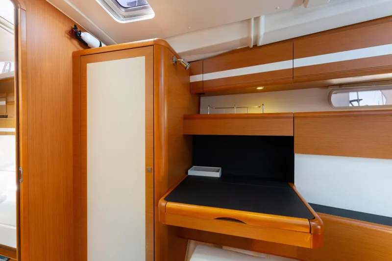 Slide: The Image of Luxurious interior cabin of a 2015 Jeanneau 53 yacht with elegant wood finishes. - 36