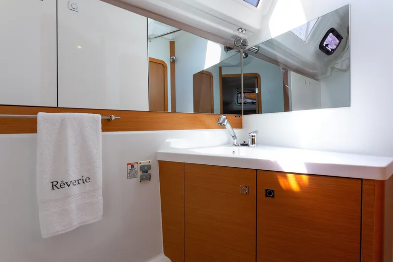 Slide: The Image of Cozy cabin interior of 2015 Jeanneau 53 yacht with bed and storage. - 41