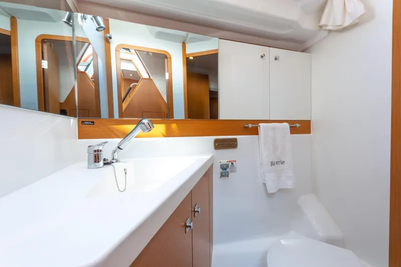 Slide: The Image of Luxurious bathroom interior of 2015 Jeanneau 53 yacht with wooden cabinetry and modern fixtures. - 45
