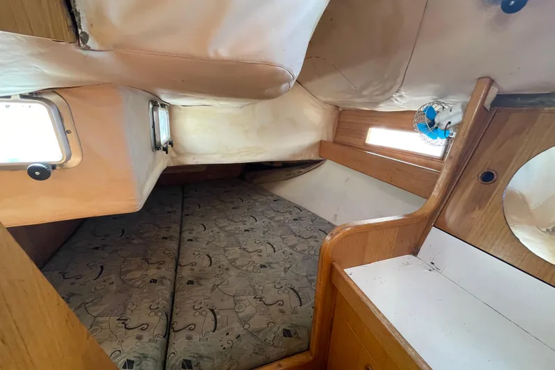 Slide: The Image of Cozy cabin interior of 1988 Beneteau Oceanis 350 sailboat with wooden furnishings. - 18