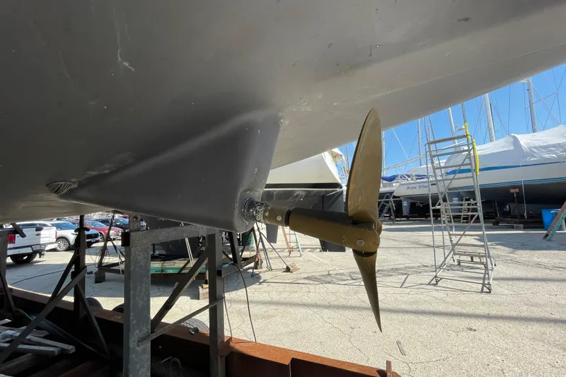 Slide: The Image of 1988 Beneteau Oceanis 350 sailboat propeller and hull in dry dock. - 7