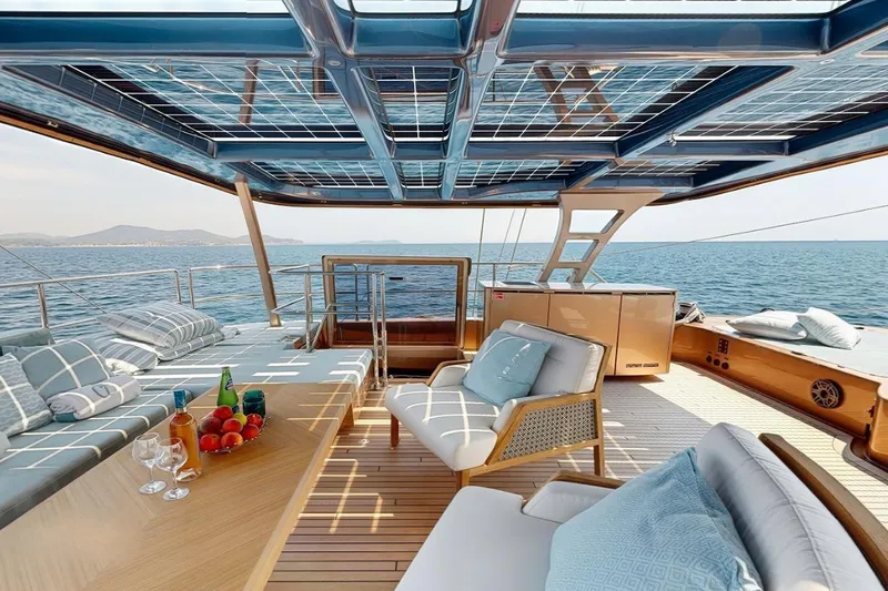 Slide: The Image of Luxurious Sunreef 60 Sail Eco yacht deck with solar panels, 2024 model, ocean view. - 4