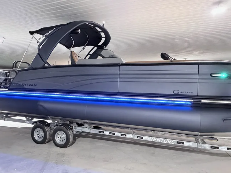 Slide: The Image of 2026 Sylvan G5 CLZ DH Arch Tritoon with blue LED lighting. - 18