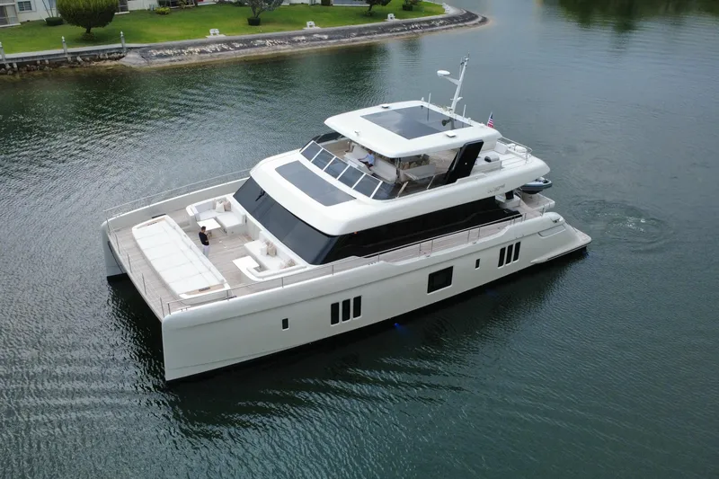 The Image of 2024 Sunreef 80 Power yacht cruising on calm waters, showcasing luxury design. - 0