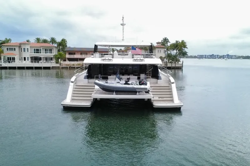 Slide: The Image of 2024 Sunreef 80 Power yacht docked, featuring spacious deck and modern design. - 1