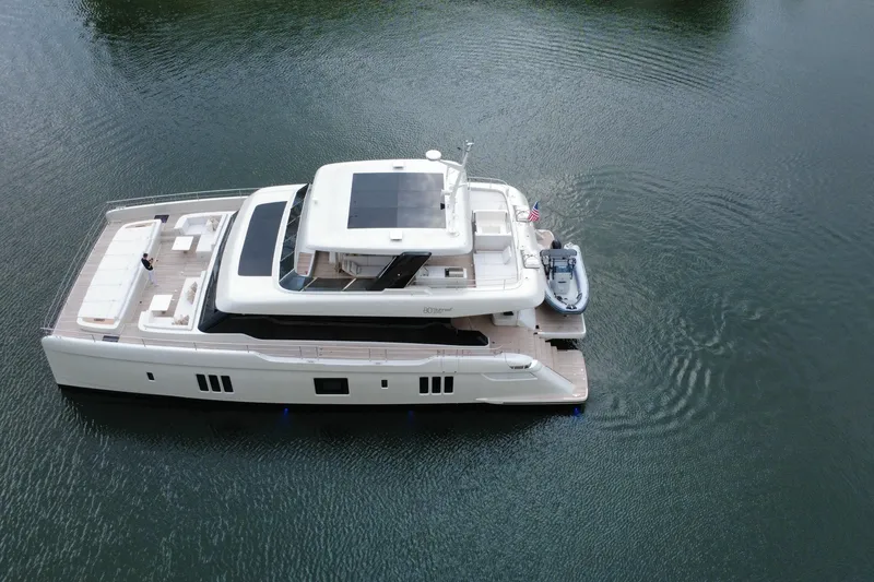 Slide: The Image of Luxury Sunreef 80 Power yacht, 2024 model, cruising on calm waters. - 24