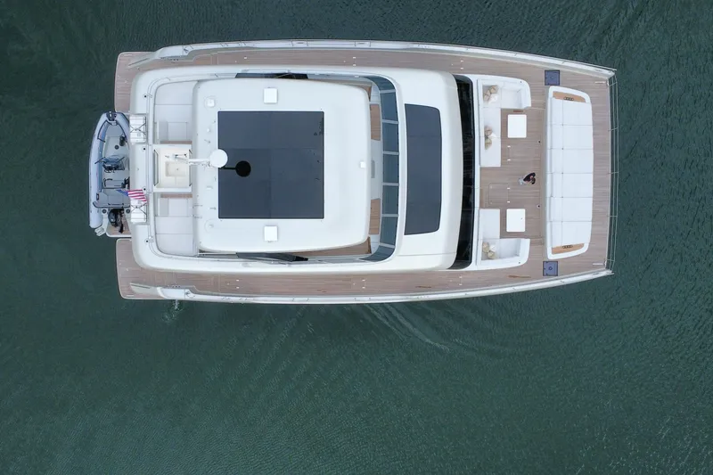 Slide: The Image of Top view of 2024 Sunreef 80 Power yacht on water, showcasing spacious deck design. - 3