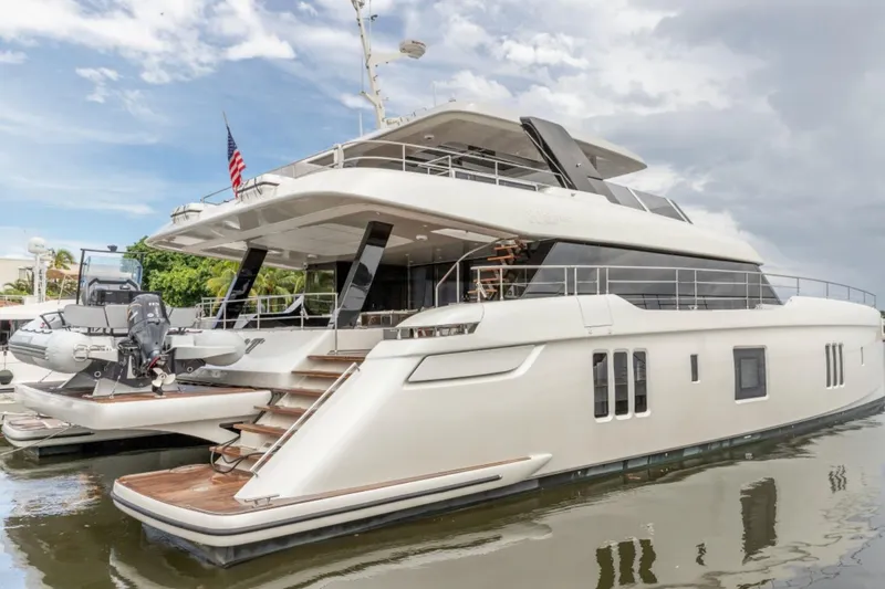 Slide: The Image of 2024 Sunreef 80 Power yacht docked, showcasing luxury design and spacious decks. - 5