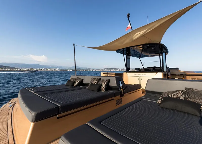 Slide: The Image of Luxurious 2018 Sunreef 40 Power yacht with sunbeds and canopy on open water. - 11