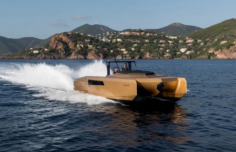 Slide: The Image of Sunreef 40 Power 2018 yacht cruising on scenic water with mountainous backdrop. - 5