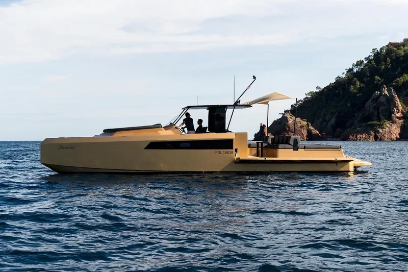 Slide: The Image of 2018 Sunreef 40 Power yacht cruising near rocky coastline. - 6
