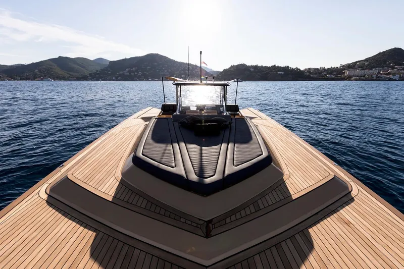 Slide: The Image of Sunreef 40 Power yacht on calm water, scenic mountain backdrop, 2018 model. - 8