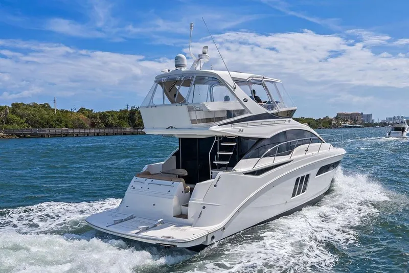 Slide: The Image of 2017 Sea Ray Fly 510 yacht cruising on a sunny day. - 13