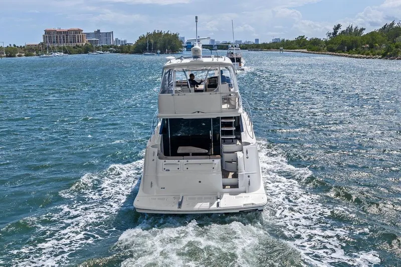 Slide: The Image of 2017 Sea Ray Fly 510 yacht cruising on a scenic waterway. - 16