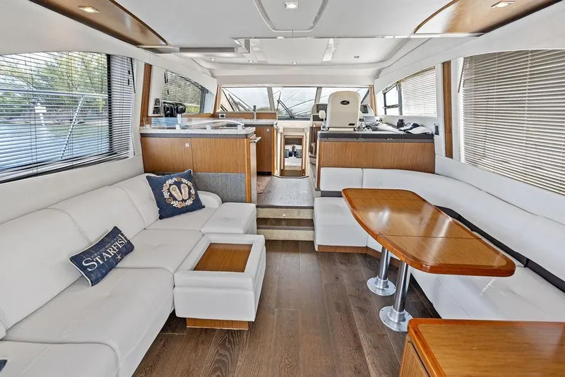 Slide: The Image of Luxurious interior of 2017 Sea Ray Fly 510 yacht with elegant seating and dining area. - 17