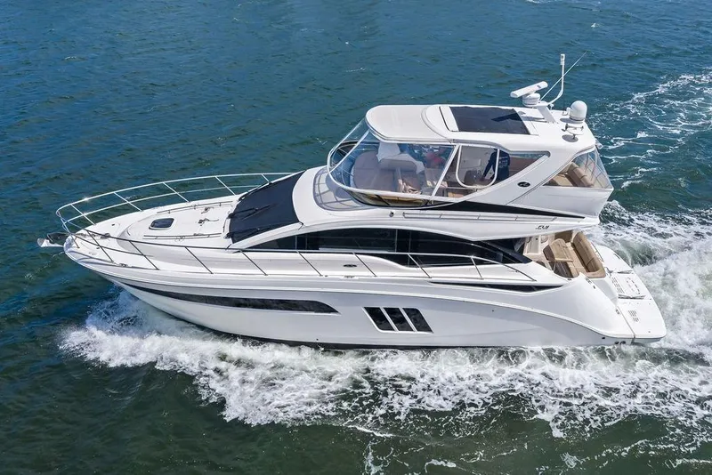 Slide: The Image of 2017 Sea Ray Fly 510 yacht cruising on open water. - 2