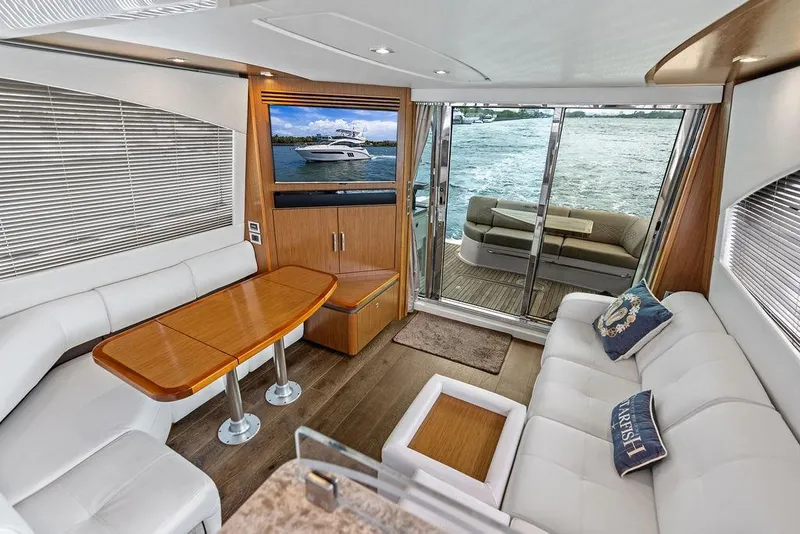 Slide: The Image of Luxurious interior of 2017 Sea Ray Fly 510 yacht with elegant seating and scenic water view. - 23
