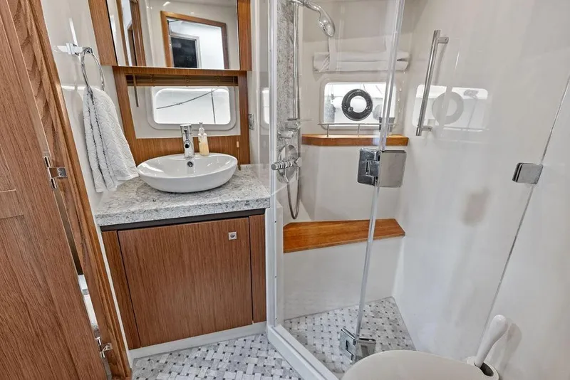 Slide: The Image of Luxurious bathroom in 2017 Sea Ray Fly 510 yacht with modern fixtures and elegant design. - 28