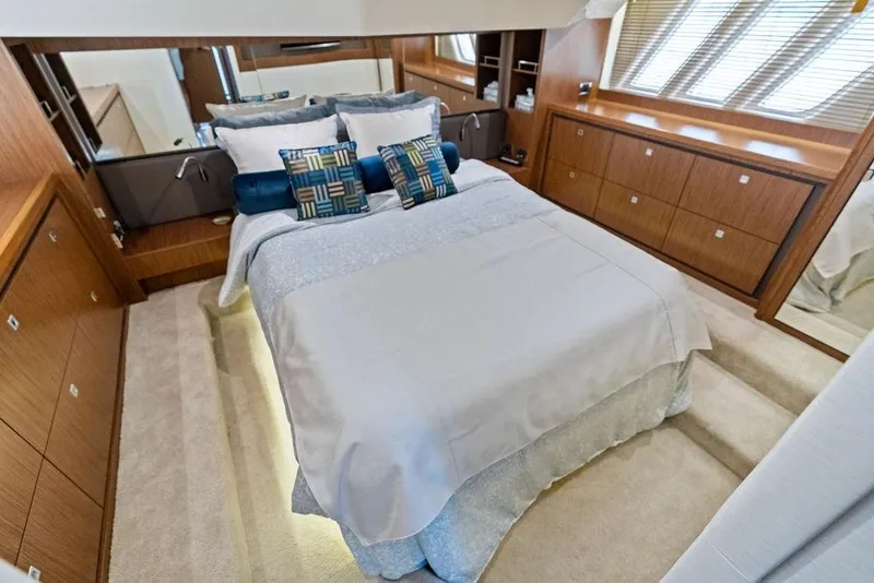 Slide: The Image of Luxurious bedroom interior of 2017 Sea Ray Fly 510 yacht with elegant wood cabinetry. - 31