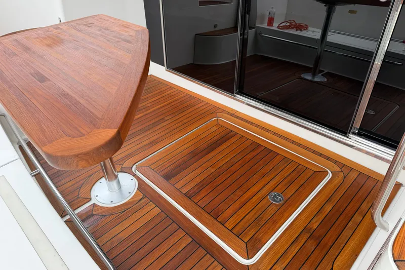 Slide: The Image of Luxurious teak deck on 2017 Sea Ray Fly 510 yacht, featuring elegant wood finish. - 35