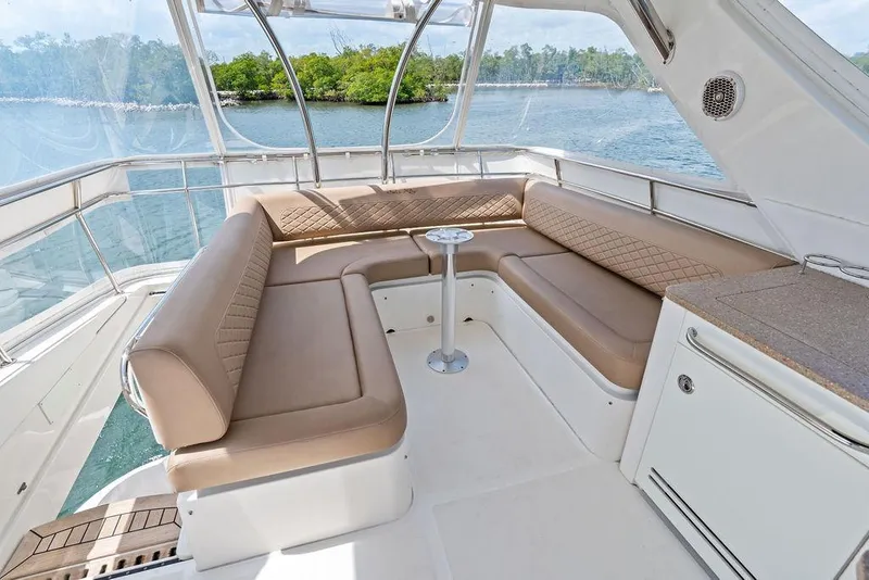 Slide: The Image of Luxurious 2017 Sea Ray Fly 510 yacht interior with elegant seating and scenic water view. - 38