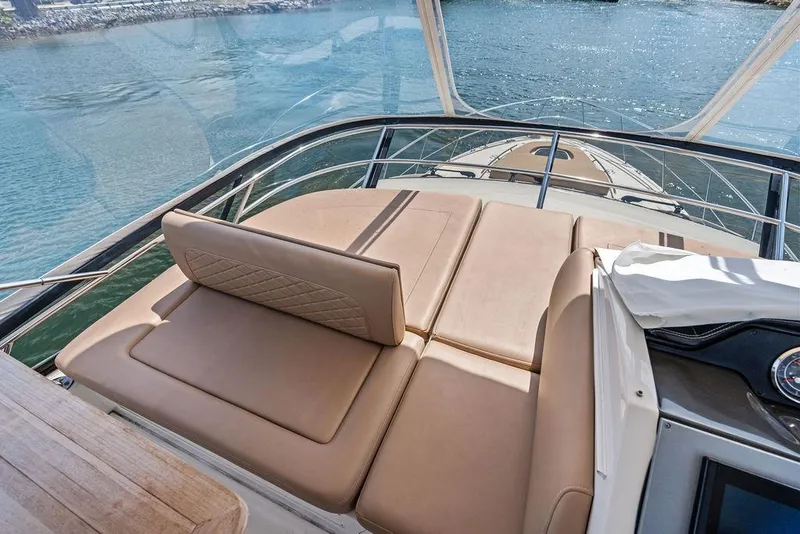 Slide: The Image of Luxurious 2017 Sea Ray Fly 510 yacht with spacious sunbathing deck on calm waters. - 39
