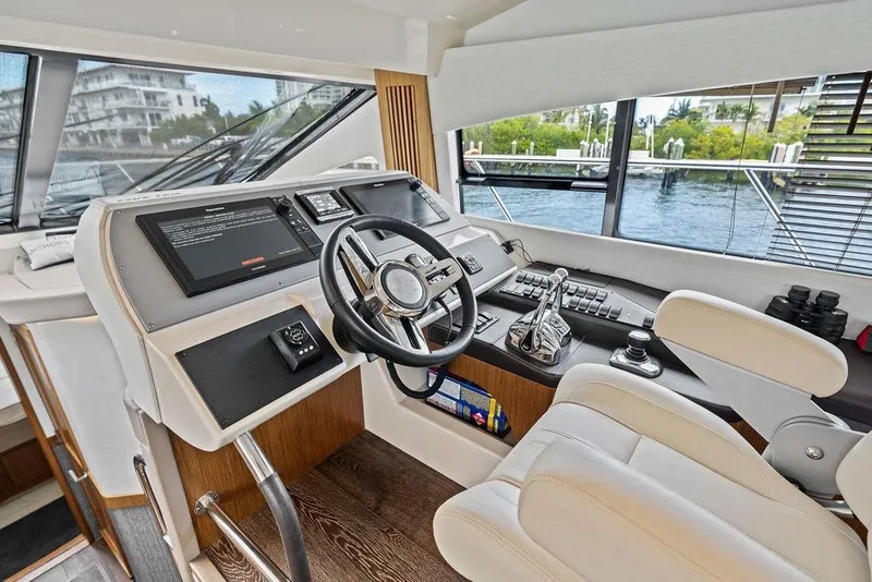 Slide: The Image of Luxurious helm of 2017 Sea Ray Fly 510 yacht with modern controls and panoramic view. - 42