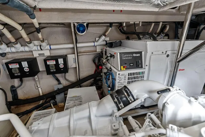 Slide: The Image of Engine room of 2017 Sea Ray Fly 510 with Cummins Onan generator and wiring. - 46