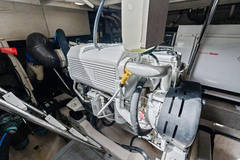 Slide: The Image of Engine room of 2017 Sea Ray Fly 510 yacht, featuring Cummins Onan generator. - 49