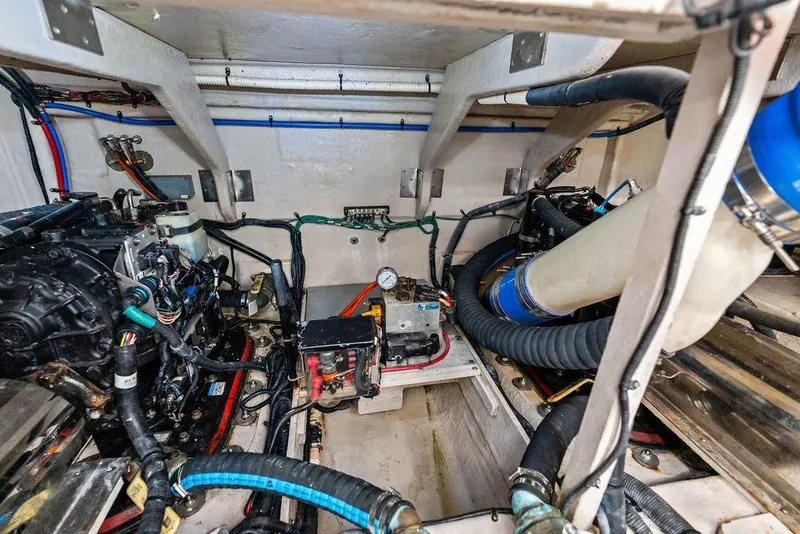 Slide: The Image of Engine room of 2017 Sea Ray Fly 510 yacht, showcasing mechanical components and wiring. - 52