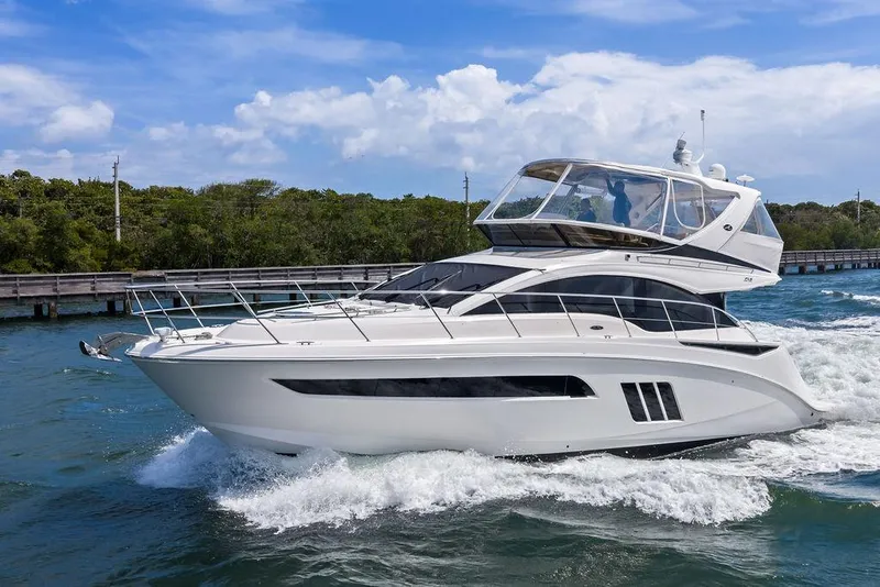 Slide: The Image of 2017 Sea Ray Fly 510 yacht cruising on a sunny day. - 6