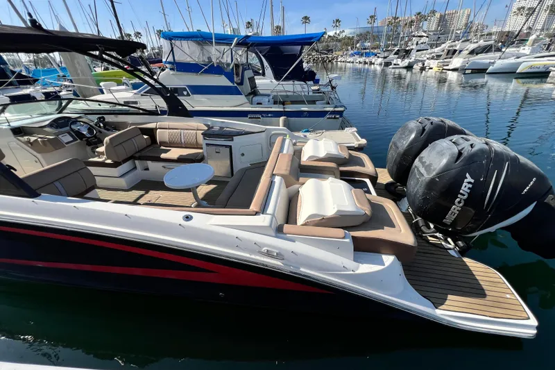Slide: The Image of 2016 Sea Ray 290 Sundeck Outboard with twin Mercury engines docked in marina. - 11