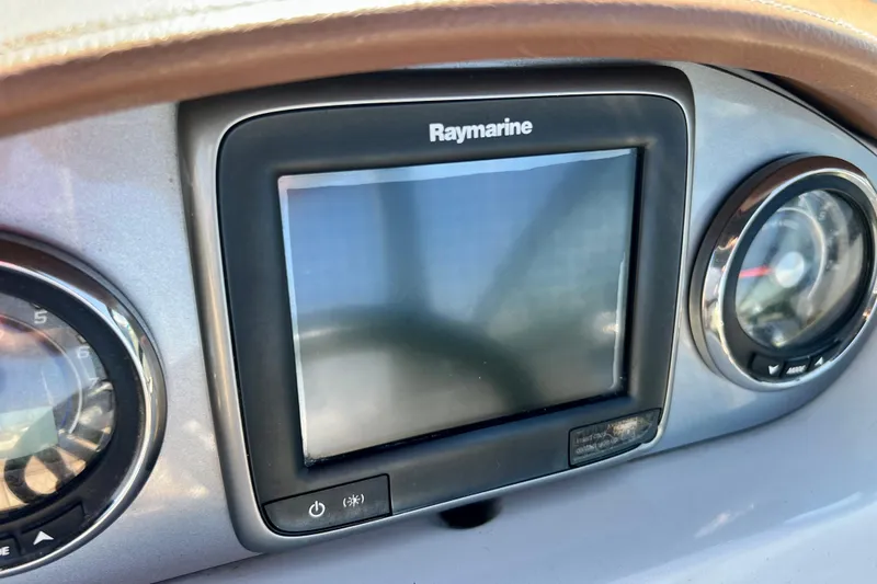 Slide: The Image of Raymarine display on 2016 Sea Ray 290 Sundeck Outboard dashboard. - 28