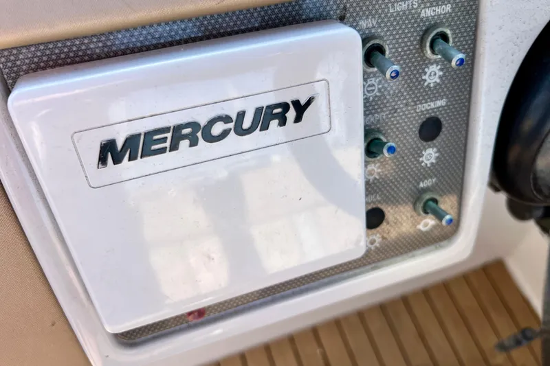 Slide: The Image of Control panel of a 2016 Sea Ray 290 Sundeck Outboard with Mercury branding. - 31