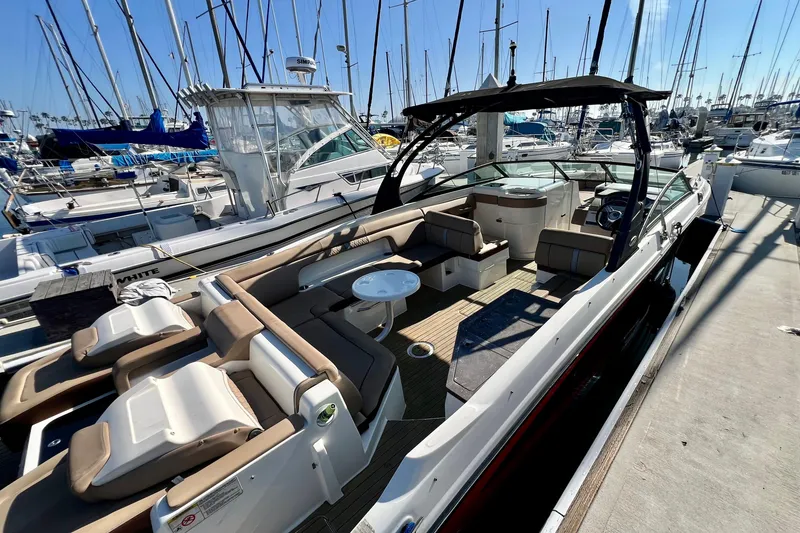 Slide: The Image of 2016 Sea Ray 290 Sundeck Outboard docked, featuring spacious seating and sleek design. - 8