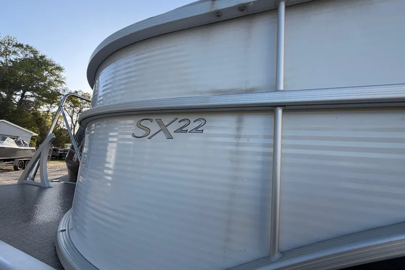 Slide: The Image of 2016 Bennington 22 SX pontoon boat, side view with model insignia. - 13