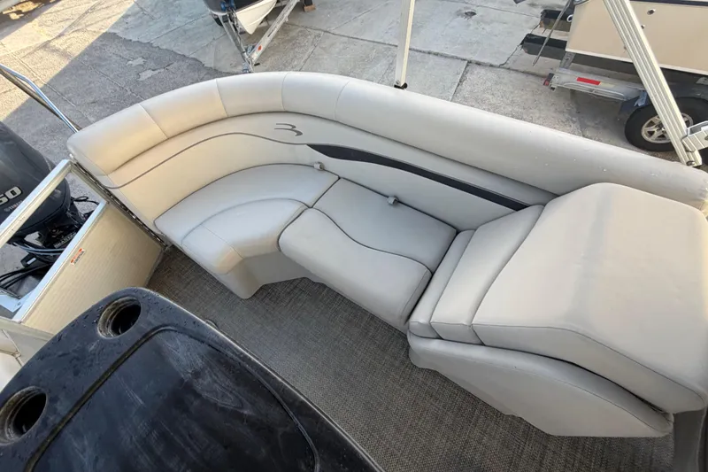 Slide: The Image of 2016 Bennington 22 SX boat interior with plush seating and carpeted flooring. - 37